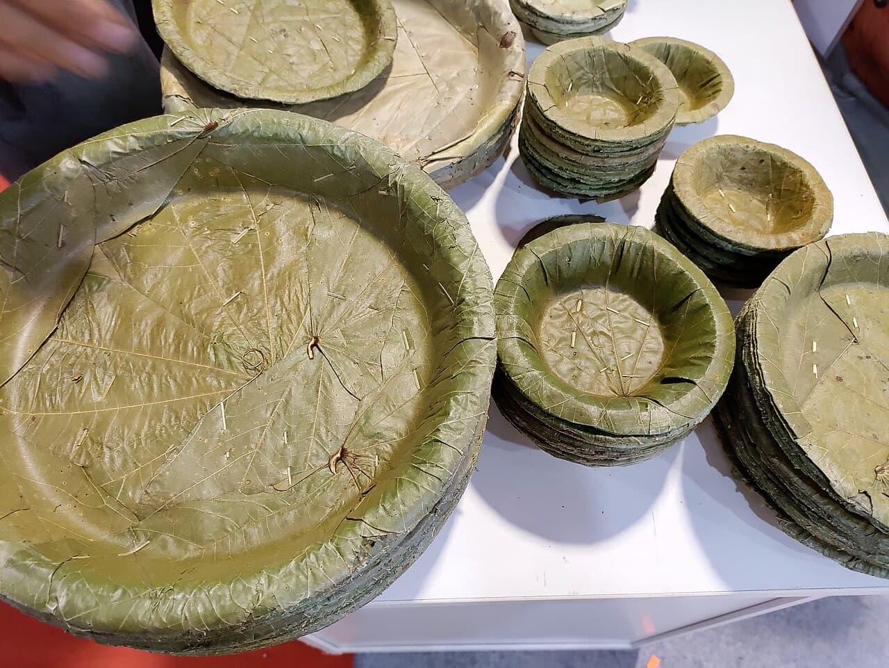 Traditional sal-leaf dona and pattal stacks on a table